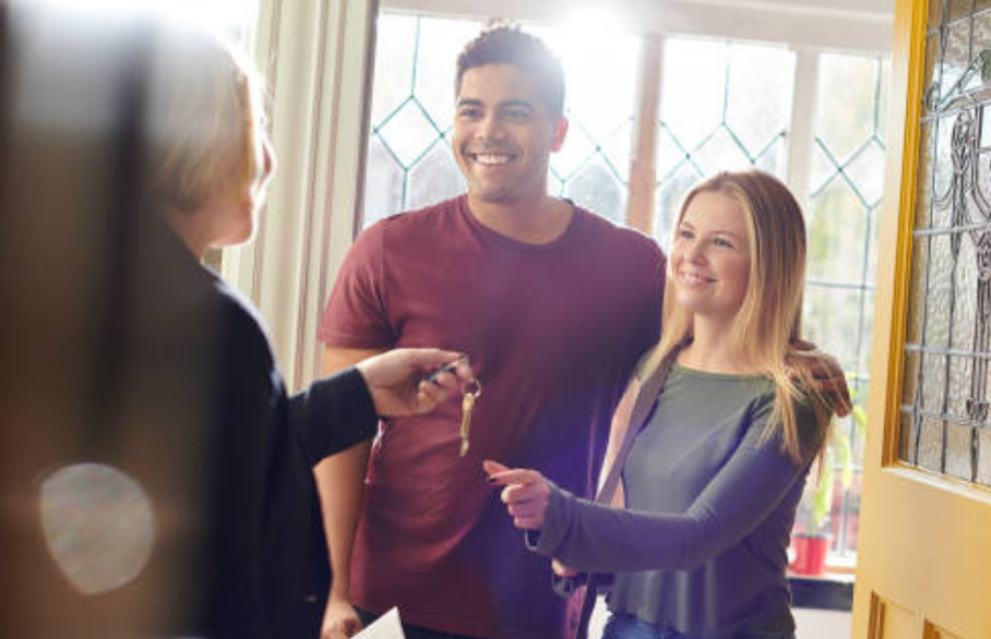 A couple receiving keys to a new home