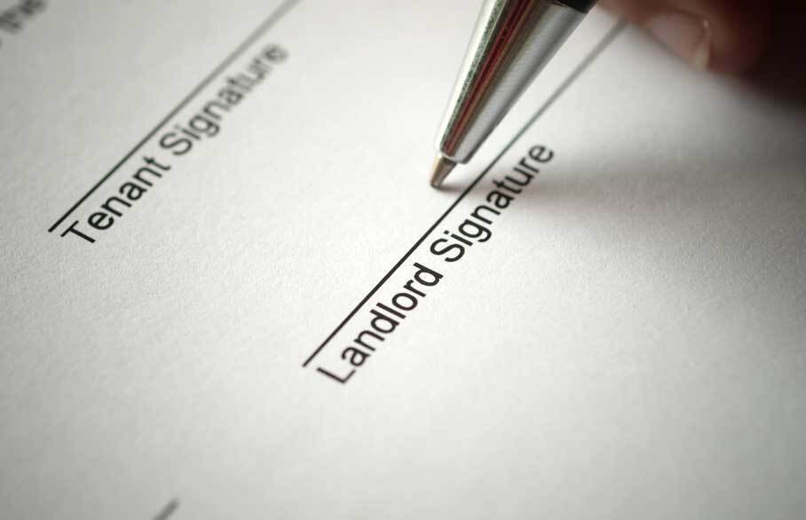 Landlord signature being signed