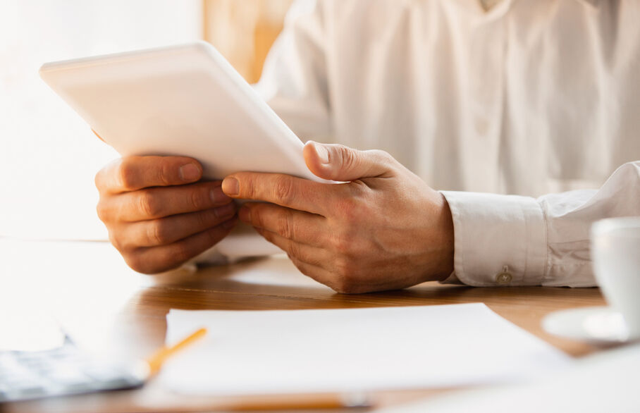 Someone holding a tablet