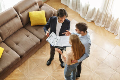 Three people viewing a house