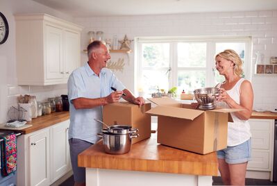 A couple packing up their kitchen