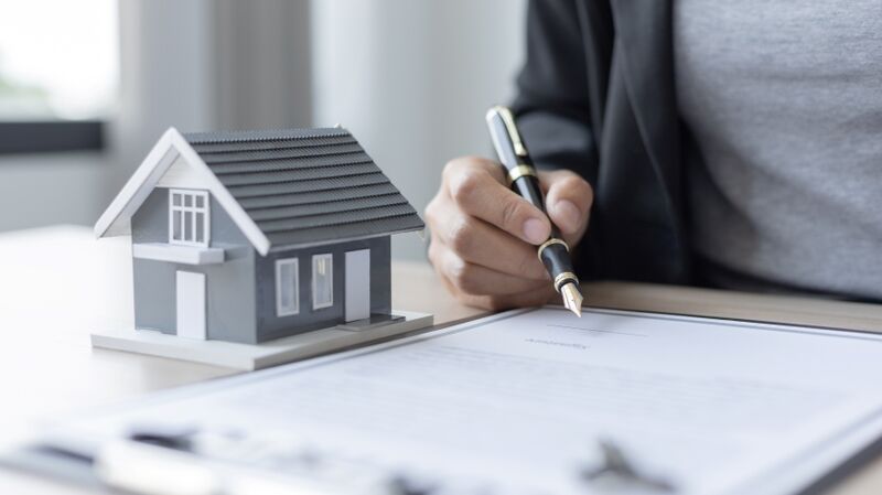 An estate agent prepares paperwork