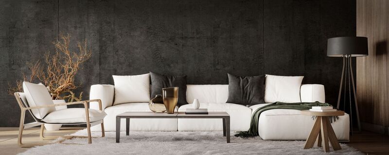 White couch on dark wall background