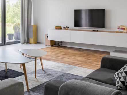 Panoramic view of luxurious living room with fireplace, tv and two couches